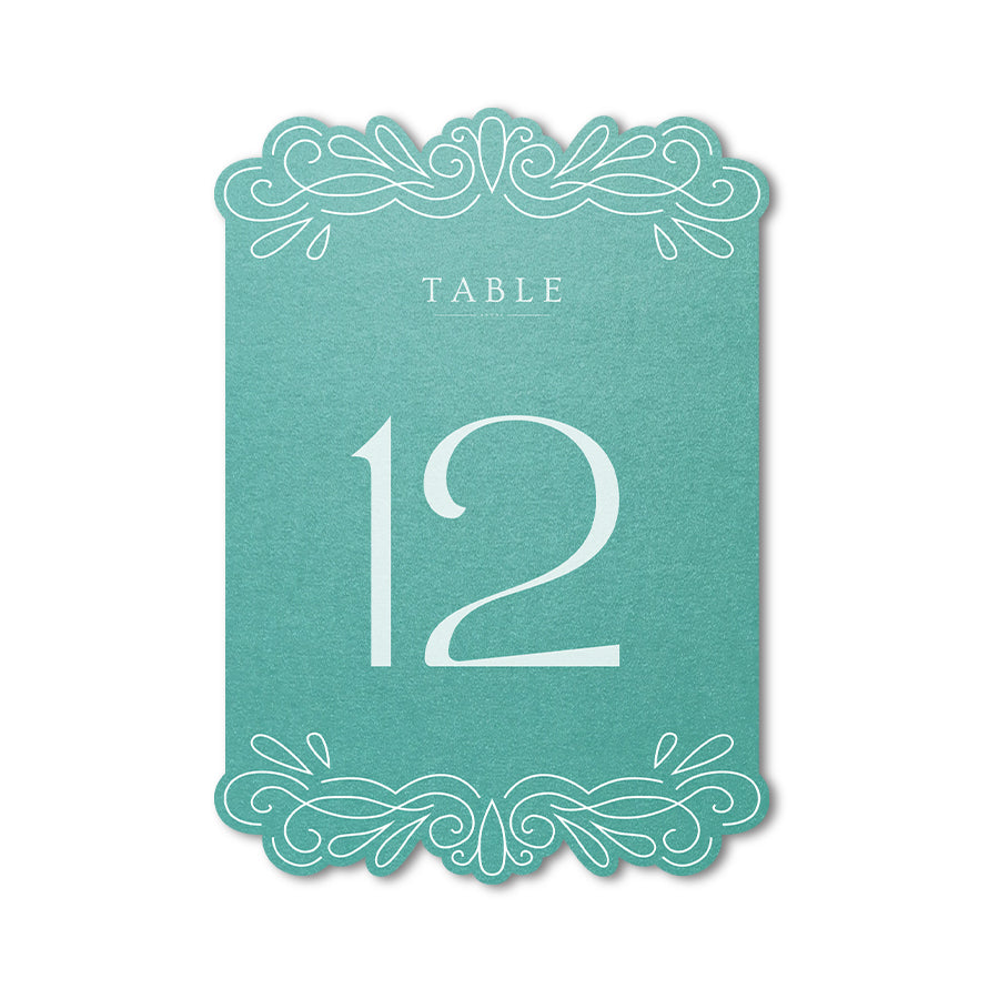 Teal table number card with white text on a white background