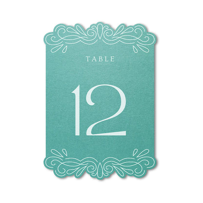 Teal table number card with white text on a white background