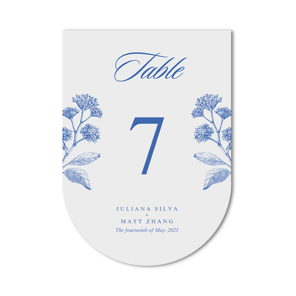 Custom silhouette table number die cut card with blue floral design on a white background