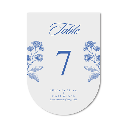 Custom silhouette table number die cut card with blue floral design on a white background