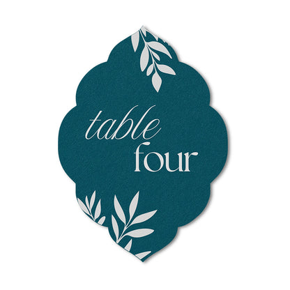 Colored cardstock wedding table number card with white text and leaf designs