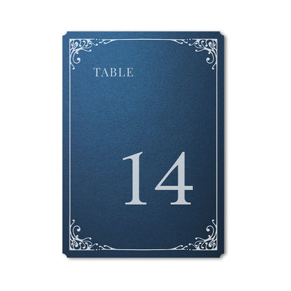 Navy blue table number card with white text and decorative elements on a white background