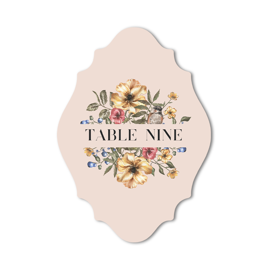 Custom shaped table number card with floral design on a beige background