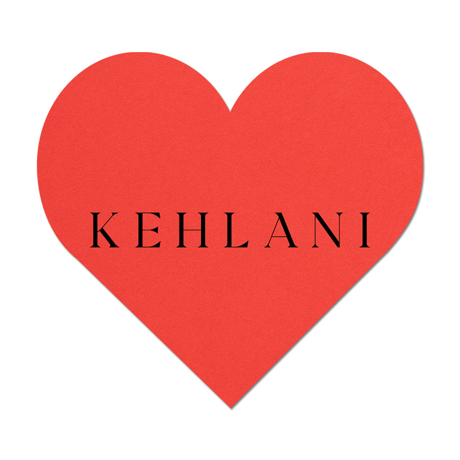 Red heart name card with 'KEHLANI' text on a white background