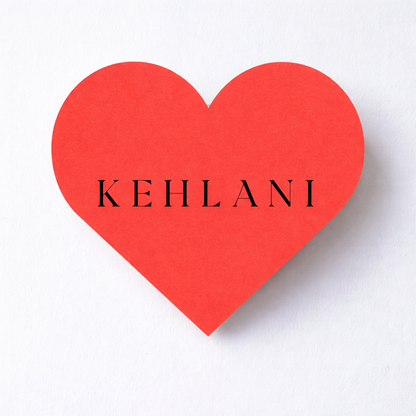 Red heart-shaped card with 'KEHLANI' text on a white background