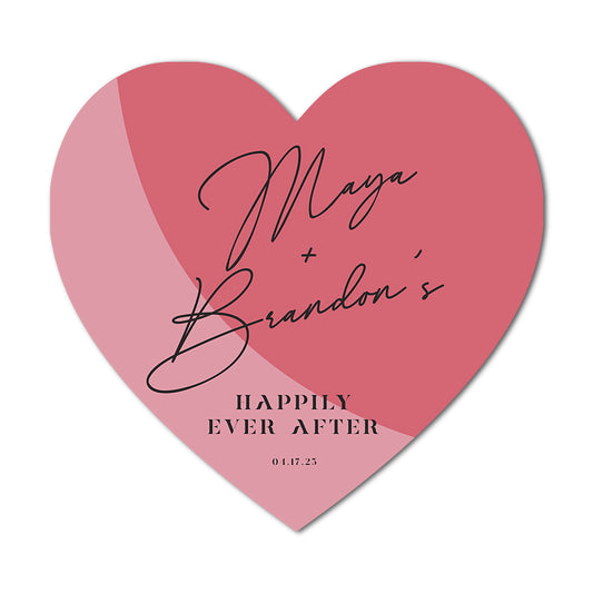 Heart-shaped custom wedding card with 'Maya + Brandon's Happily Ever After' text on a pink background