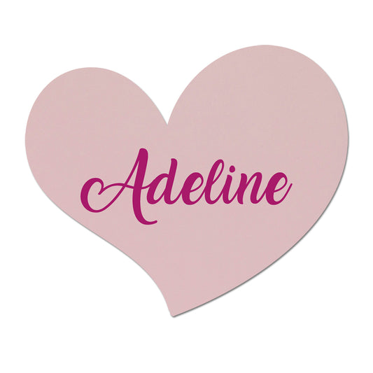 Heart-shaped pink wedding card with 'Adeline' written on it against a white background