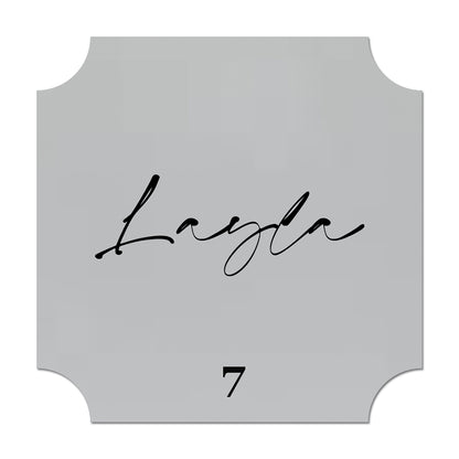 Decorative name card with 'Layla' and number '7' on a gray background