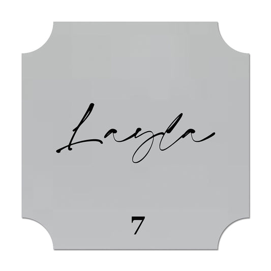 Decorative name card with 'Layla' and number '7' on a gray background