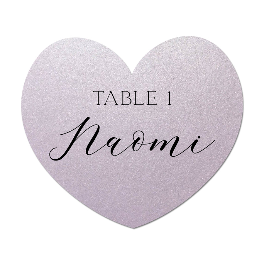 Heart-shaped table card with 'Table 1 Naomi' text on a white background