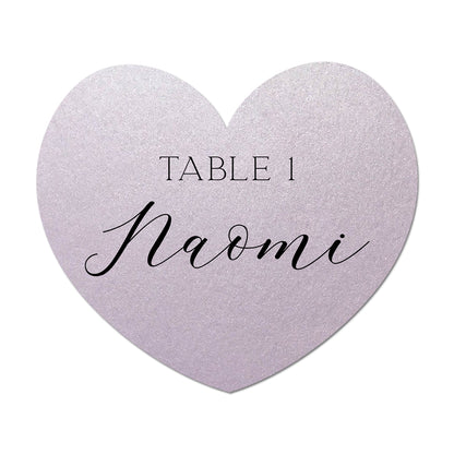 Heart-shaped table card with 'Table 1 Naomi' text on a white background