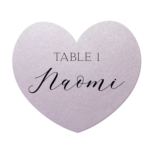 Heart-shaped table card with 'Table 1 Naomi' text on a white background