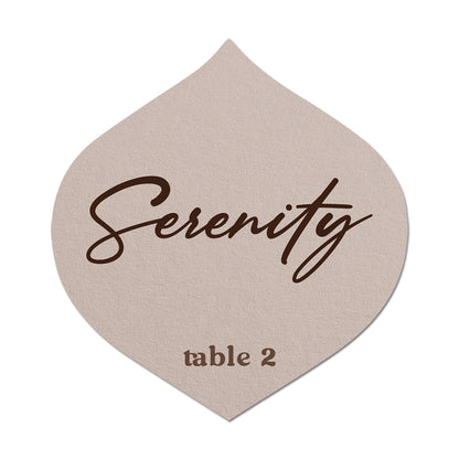 Beige name card with 'Serenity' and 'table 2' printed on it
