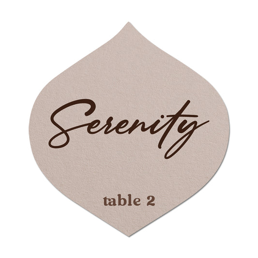 Beige name card with 'Serenity' and 'table 2' printed on it