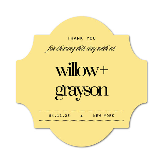 Yellow wedding label with black text for a wedding, featuring bride and groom names and wedding date.