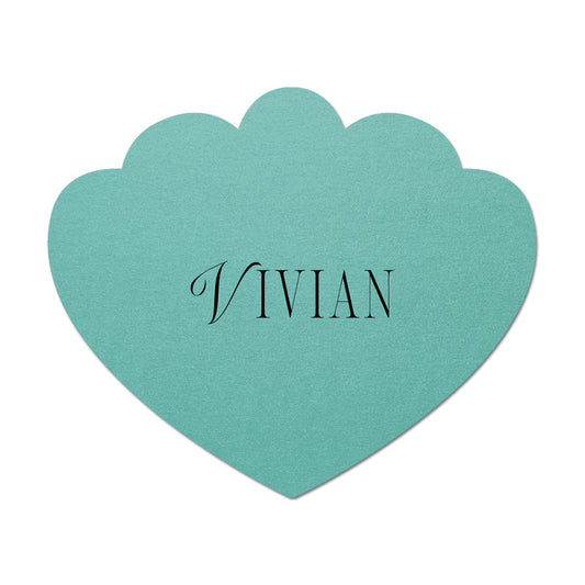 Teal scallop-shaped card with 'Vivian' printed on it against a white background