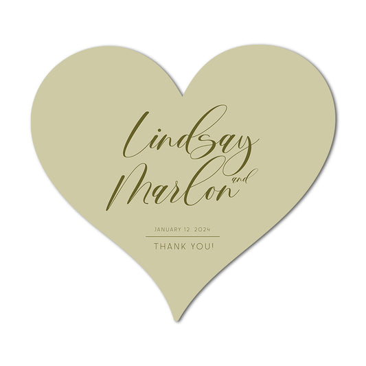 Heart-shaped favor card with gold text on a white background